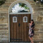 Historic St. Augustine, Florida brunette standing in front of historic door