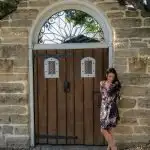Historic St. Augustine, Florida brunette standing in front of historic door