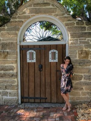 Historic St. Augustine, Florida brunette standing in front of historic door