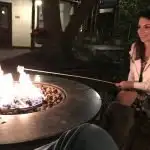 St. Francis Inn B&B with brunette girl roasting marshmallows