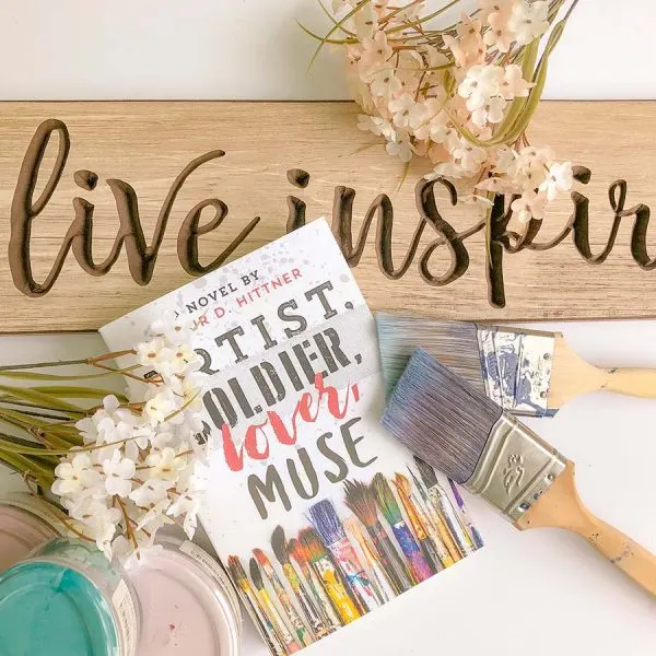 Books for Art Lovers Bookstagram of Artist, Soldier, Lover, Muse with paintbrushes, flower, and pink paint