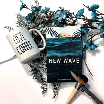 New Wave Bookstagram with book cover, flowers, coffee mug, and blush brushes