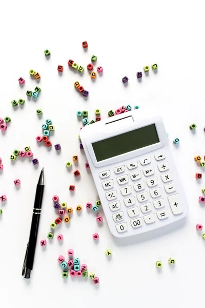 LLC For Bloggers Self Employment Taxes with white calculator, pen, and colorful letters