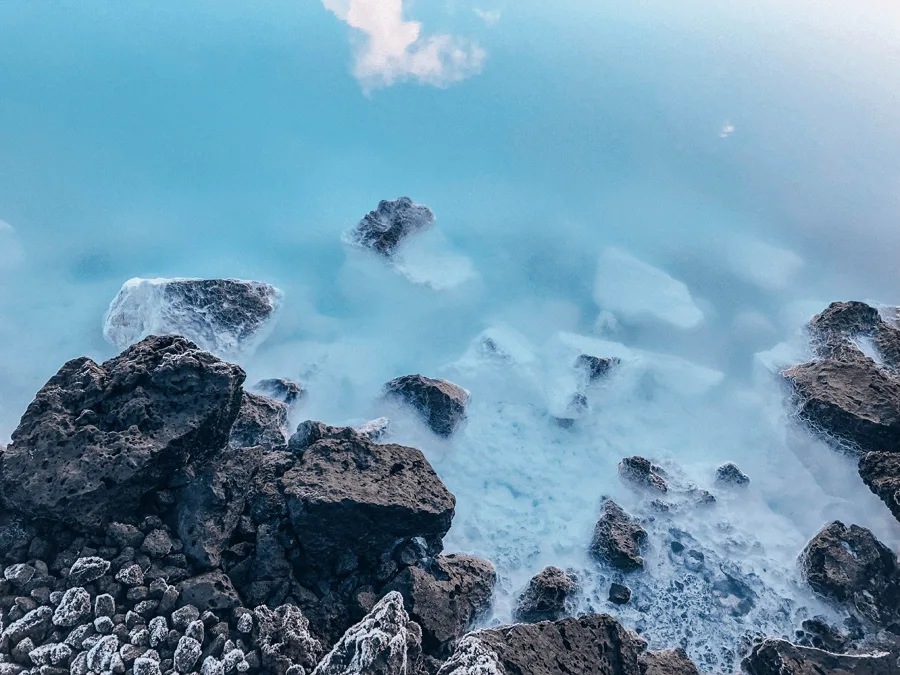 turquoise water with black rocks from The Blue Lagoon Geothermal Spa Iceland
