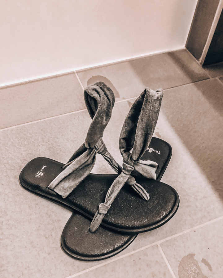 frozen grey sandals on the shower room floor of The Blue Lagoon Retreat and Spa