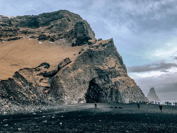 7  Day Iceland itinerary Reynisfjara black sand beach with rock formations and basalts