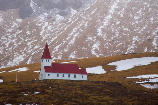 Red and White Church on a hill In Vik Iceland