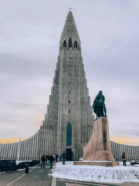 Hallgrímskirkja Iceland with triange shaped church and statue out front