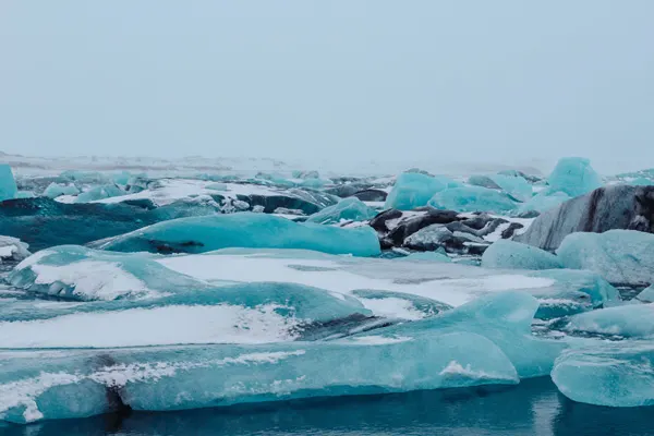 Iceland Itinerary 7 Days Jokulsarlon glacier lagoon with blue and white glaciers floating on water