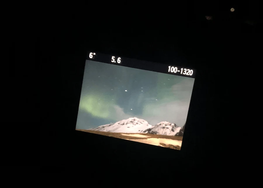 Visiting Iceland in the winter with Northern Lights on a camera viewfinder in Iceland