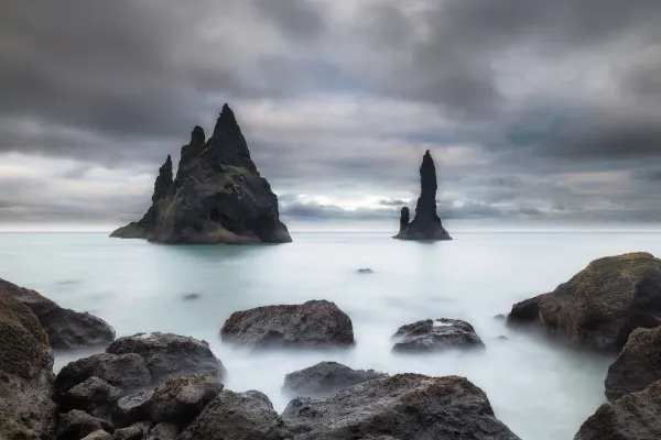 Reynisfjara Beach Black Sand Beach Basalt Columns with clouds and mist in Southern Iceland