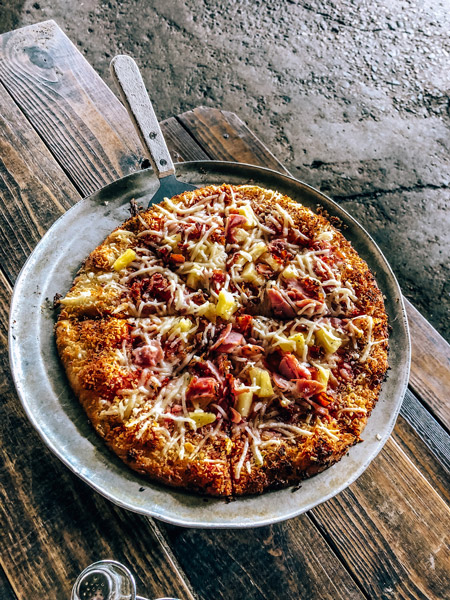 Asheville Pizza and Brewing Company gluten free pizza with vegan cheese