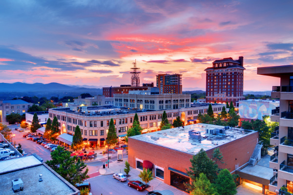 Moving To Downtown Asheville North Carolina with cityscape at sunset