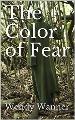 The Color of Fear by Wendy Wanner book cover with person in long green robe walking in woods