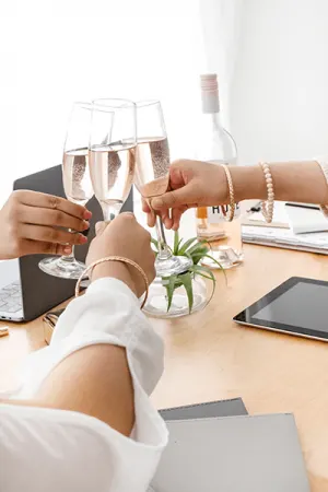 Blogger tricks picture of cheering with wine glasses as friends
