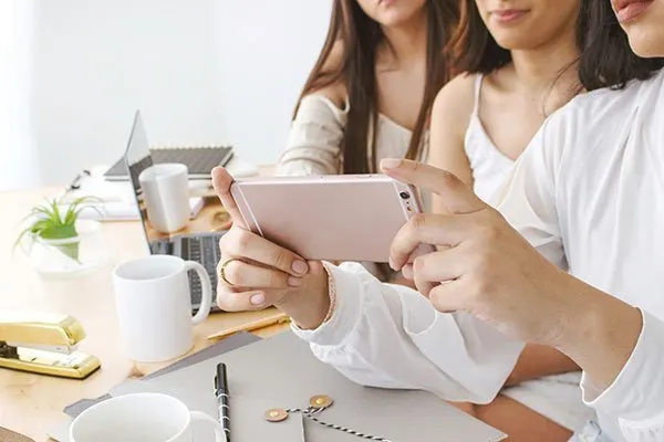 Blogging tips and tricks about community with three girls on computers and phones