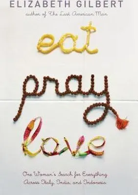 Eat Pray Love by Elizabeth Gilbert book cover with writing spelled out in pasta, prayer beads and flowers