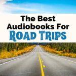 Best Audiobooks For Road Trips featured image with pavement road with yellow lines surrounded by green trees and bushes with blue mountains and clouds in background