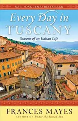 Every Day In Tuscany by Frances Mayes book cover with Italian town with stucco orange houses, road and mountatins