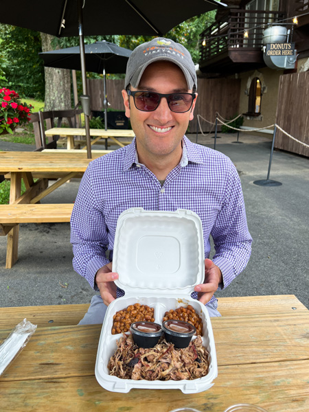 Tom with BBQ from Jeter Mountain Farms 1813 Smokehouse
