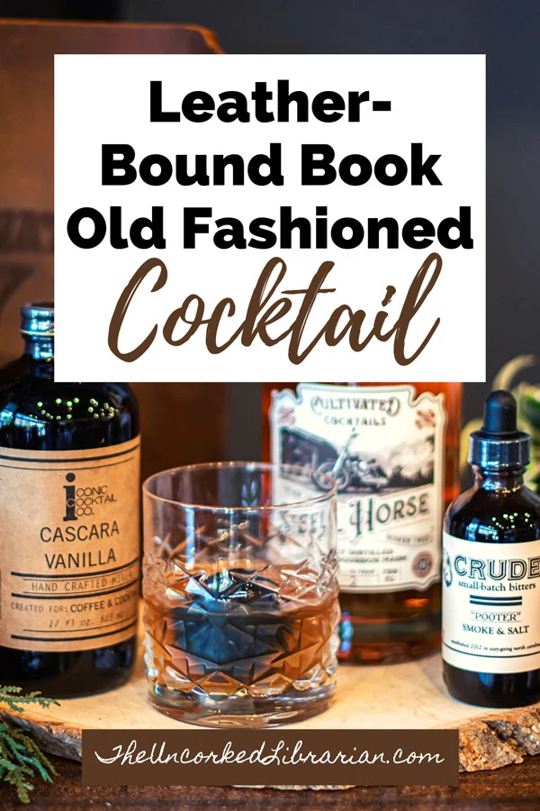 Leather Bound Book Smoked Old Fashioned Recipe Pinterest Pin with brown old fashioned, bitters, and whiskey