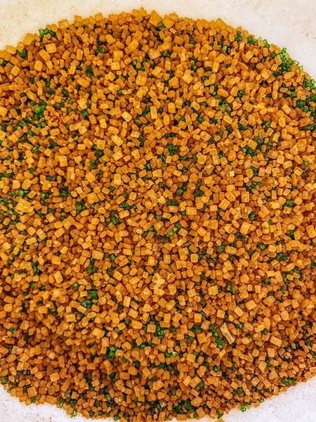 Cheerwine Cocktail rim with brown sugar in the raw and green sprinkles