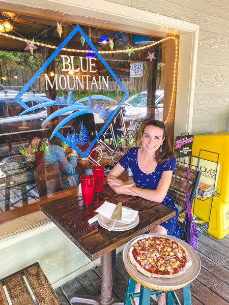 Blue Mountain Pizza Christine with pizza