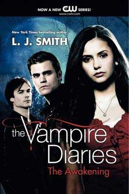 The Vampire Diaries: The Awakening by L.J. Smith book cover with 2 young pale men and one brunette woman in red shirt