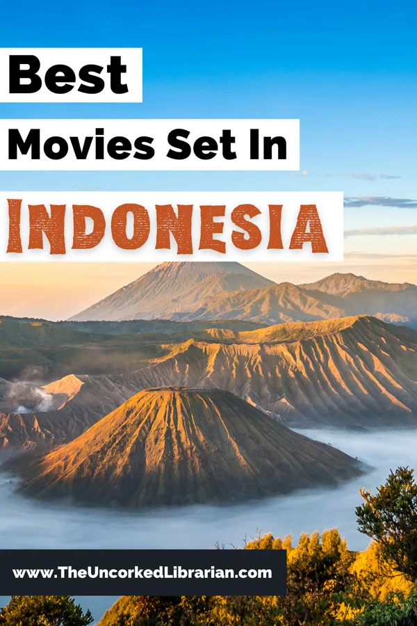 Best Movies Set In Indonesia Pinterest Pin with photo of Mount Bromo at sunrise with clear blue sky, water, and brown volcano craters