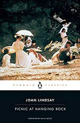 Picnic At Hanging Rock by Joan Lindsay book cover with classic marker and women in older period clothing with umbrellas