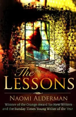 The Lessons by Naomi Alderman book cover with desk with flowers overlooking window