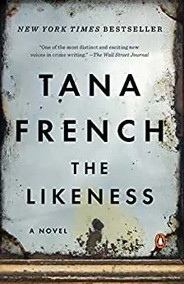 The Likeness by Tana French book cover with blue-gray background and what looks like rust stains