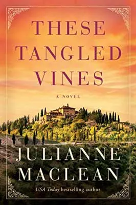 These Tangled Vines by Julianne Maclean book cover with Tuscan winery on a hill surrounded by vineyard and trees with orange sky