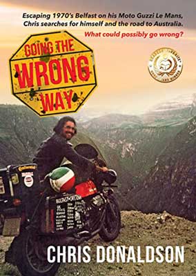 Going the Wrong Way by Chris Donaldson book cover with man and his bike overlooking a cliff to the mountains