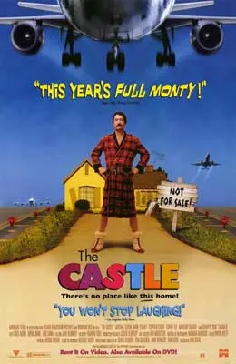 The Castle Movie Poster with man in checked red robe standing on driveway in front of house