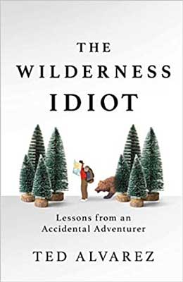 The Wilderness Idiot: Lessons from an Accidental Adventurer by Ted Alvarez book cover with person wearing backpack, red shirt, and brown pants standing between two sets of four green trees