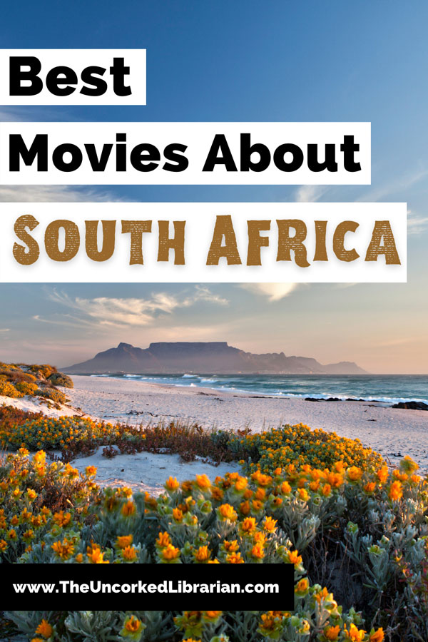 Best South African Movies and Movies Set In South Africa Pinterest pin with photo of water, flowers, and mountain in Cape Town