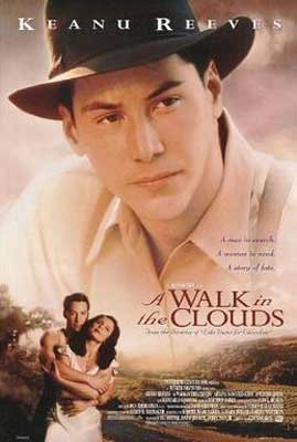 A Walk in the Clouds Movie Poster with large picture of man in hat and white shirt over smaller image of man embracing a woman