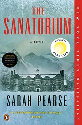 The Sanatorium by Sarah Pearse book cover with gray hued hotel with mountains behind it