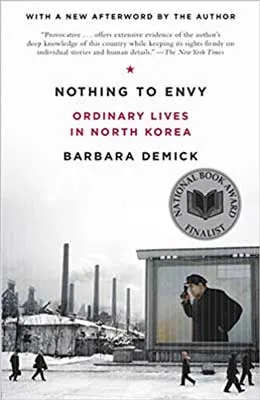 Nothing to Envy: Ordinary Lives in North Korea by Barbara Demick book cover with gray factory like area and people walking on the street