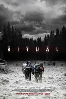 The Ritual Movie poster with four backpackers walking into what looks to be a dark and snowy forest
