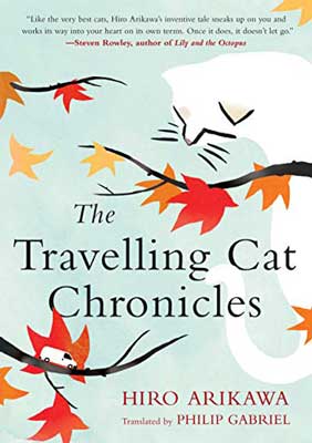 The Traveling Cat Chronicles by Hiro Arikawa book cover with illustrated white cat and red, yellow, and orange leaves on branches