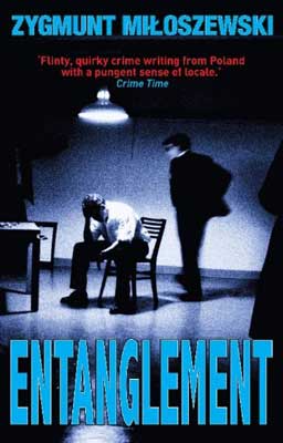 Entanglement by Zygmunt Miloszewski book cover with one man interrogating another in room under lamp