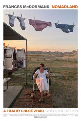 Nomadland movie poster with older woman in white dress sitting in a chair on lawn with laundry hanging on line above her