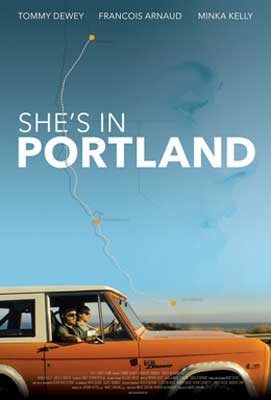 She’s in Portland Movie Poster with burnt orange car with people in it driving with blue sky
