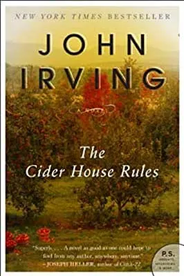 The Cider House Rules by John Irving book cover with landscape filled with green grass and trees