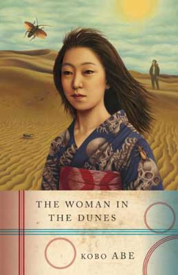 The Woman in the Dunes by Kobo Abe book cover with woman's portrait and sand behind her