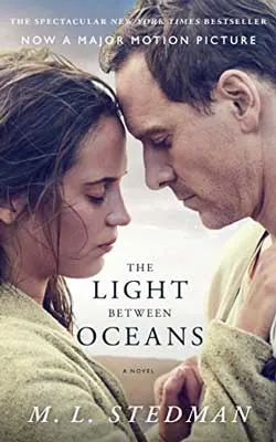 The Light Between Oceans by M. L. Stedman with white brunette man and woman touching heads