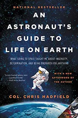 An Astronaut’s Guide to Life on Earth by Chris Hadfield with astronaut flying through blue-black space