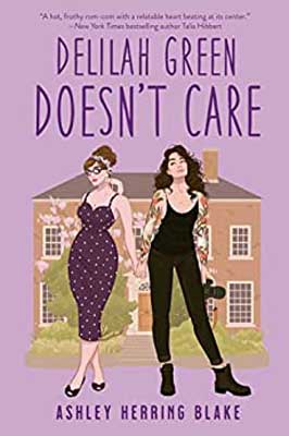 Delilah Green Doesn't Care by Ashley Herring Blake book cover with house and two people - one in a dress and one in a black jumper - in front of it on purple background 